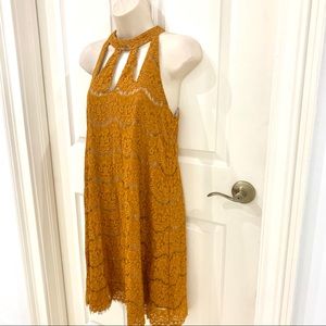 Golden lace dress with cut out neck detail